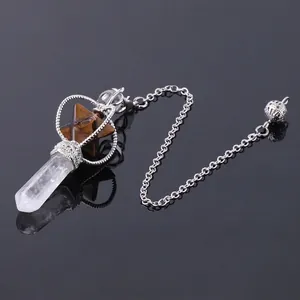 Rotating Merkaba star pendant with white crystal point and tiger eye stone in silver frame