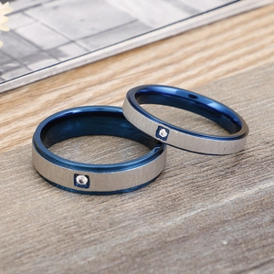 Brushed titanium steel ring set with blue lining and center diamond inlay for couples