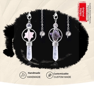 Detail of handmade Merkaba pendulums with natural rose quartz and amethyst crystals