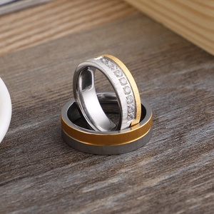 Minimalist titanium steel frosted couple rings set with gold accents and sparkling diamonds