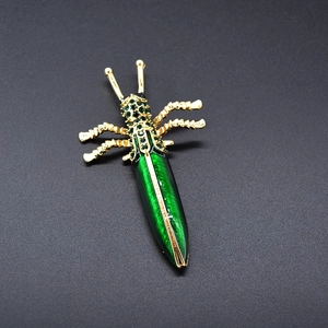 Baroque colorful insect brooch with green enamel and rhinestones in gold finish