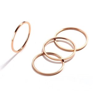 Set of four minimalist 18K rose gold plated stackable stainless steel rings for women