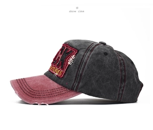 Detail of distressed baseball cap with embroidery, vintage washed cotton and torn edges