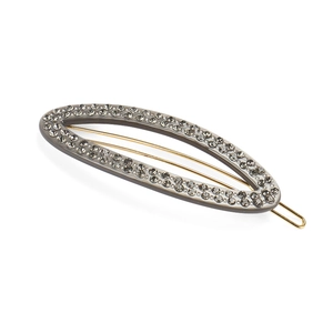 Detail view of gray acetate hair clip with sparkling rhinestones and metal spring clip