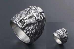 Macro detail showing lion head carving and brushed finish of this men's steel ring