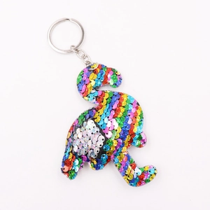 Sparkling flamingo keychain with colorful sequins and metal ring on white background