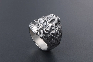 Detailed macro view of the sculpted lion head features on this vintage steel ring