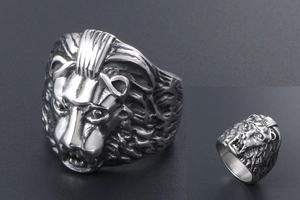 Macro detail of silver lion head ring with embossed texture and side engraving