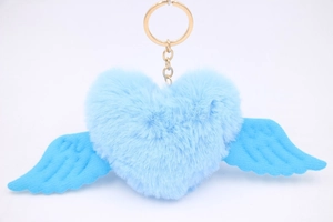 Detail view of a blue plush heart keychain with soft wings and a golden metal ring