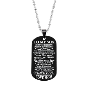 Close-up of black titanium dog tag necklace with To My Son message on white background