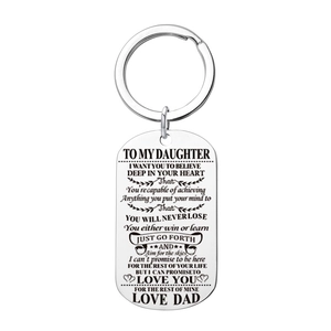 Detail of silver stainless steel dog tag keychain with engraved message from Dad to daughter