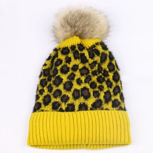 Yellow leopard print knit beanie with thick pompom for women in winter style