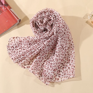 Close-up of lightweight leopard print chiffon scarf with elegant sheer fabric texture