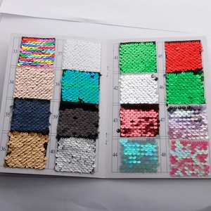 Detailed color card showcasing various reflective fish scale sequin fabric swatches