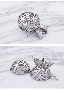 Detail of silver hollow spherical diffuser pendant with angel wings shown open and closed