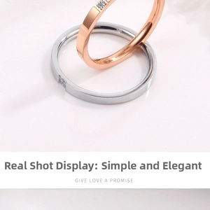 Close-up of minimalist rose gold and silver rings with single square-cut diamond setting