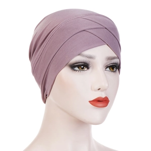 Detail of cross-front design on purple stretch fabric turban headscarf for women
