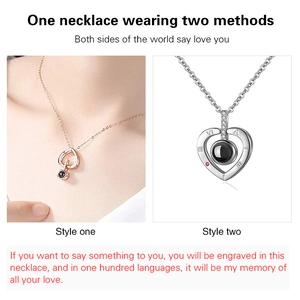 Detail view of heart pendant necklaces in gold and silver with hidden 100 languages projection