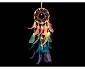 Detail of handmade dream catcher with warm LED lights and colorful gradient feathers