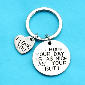 Polished stainless steel heart keychain with playful romantic text engraving