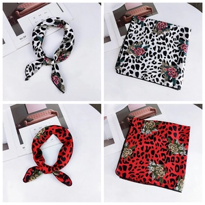 Detail view of leopard and floral print silk square scarf in white and red colors