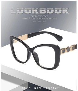 Close-up of cat-eye frames with elegant gold metal geometric accents on the temples