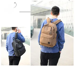 Zaino in tela con porta di ricarica USB in nero e marrone per viaggi e studenti