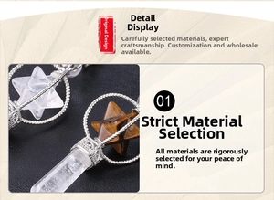 Detail view of rotating Merkaba pendants in clear quartz and brown tiger eye stone