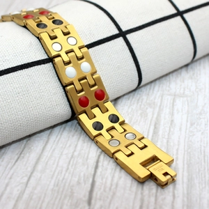 Detail of 15mm gold stainless steel magnetic therapy bracelet with inset stones