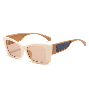 Fashionable cat eye sunglasses with cream frames and brown crocodile texture temples