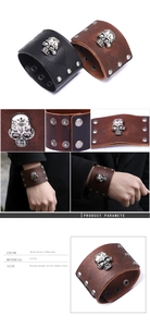 Macro view of punk style cowhide leather bracelet featuring metal skull charms and snap buttons