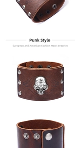 Detail of dark brown grain leather bracelet with silver skull charm and metal rivets