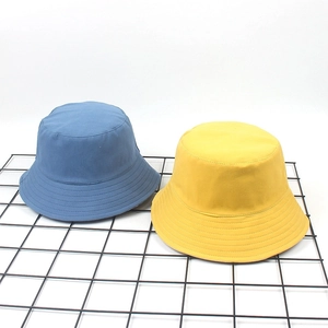 Simple solid blue and yellow cotton bucket hats for summer outdoor sun protection