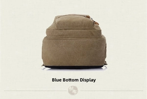 Close-up of the durable reinforced black bottom and khaki canvas texture of the backpack