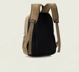 Detail of canvas backpack back featuring breathable mesh padding and adjustable straps