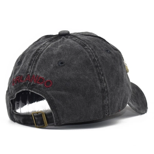 Faded black denim baseball cap with red Orlando embroidery and adjustable metal buckle