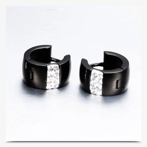 Macro shot of 7mm black titanium steel hoop earrings featuring inlaid clear crystals