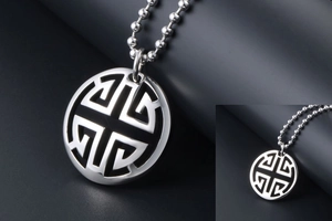 Detailed view of a silver hollow geometric circle pendant necklace with beaded chain