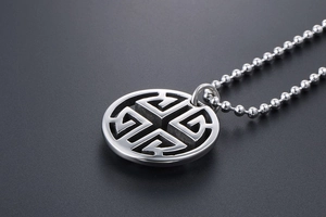 Close-up of vintage silver necklace featuring hollow geometric circle pendants and bead chain