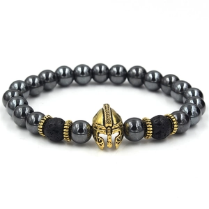 Detail of hematite beaded bracelet featuring an antique gold Spartan helmet and gear spacers