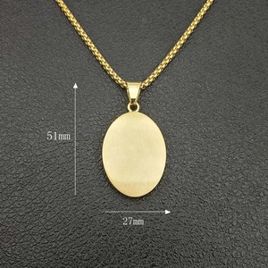 Detailed view of large gold-plated Virgin Mary pendant with 51mm by 27mm dimensions