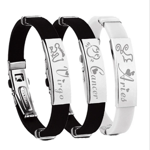 Detailed view of zodiac silicone bracelets with stainless steel plates and engraved names