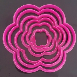 5-piece nested plum blossom cookie cutters set in bright pink plastic for baking