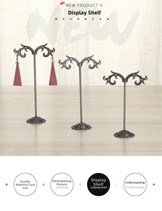 Three-tier vintage metal earring stands with engraved round bases and wavy scroll top hooks