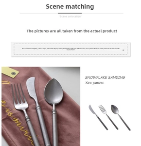 Close-up of snowflake sanded stainless steel flatware with matte dark grey finish