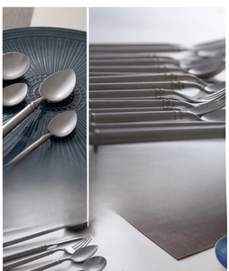 Detail of vintage stainless steel cutlery set with frosted snowflake matte finish