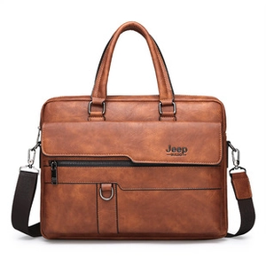Close-up of brown business briefcase featuring metal D-ring and vintage leather texture