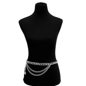 Detail view of multi-layered silver waist chain with coin pendant on black model