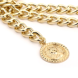 Retro chunky gold chain body jewelry with embossed Elizabeth II coin pendant detail