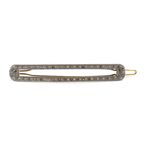 Detailed view of grey acetate hair clip with sparkling rhinestones and gold metal frame